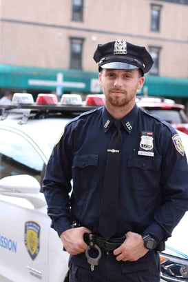 police officer standing next to car