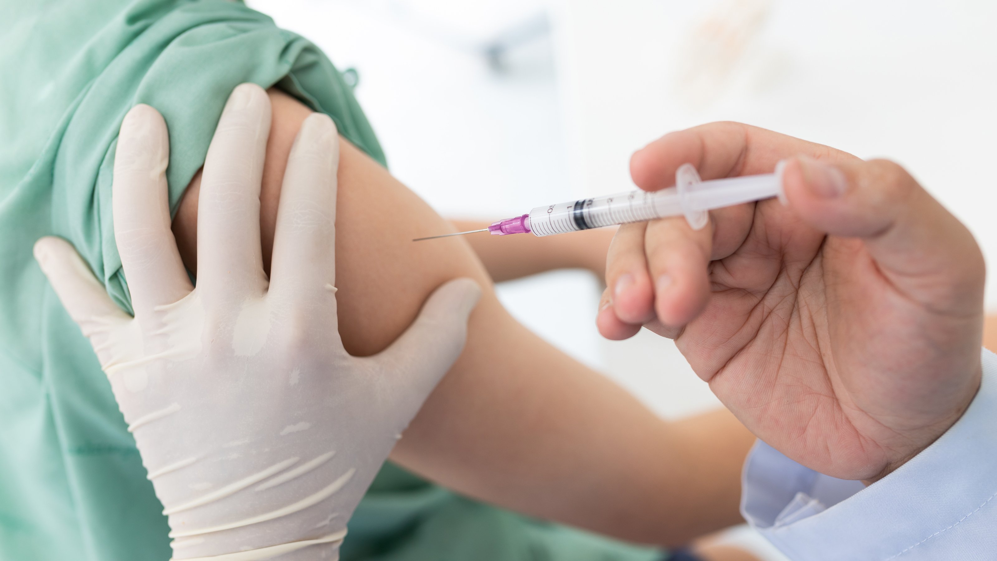 Vaccine being given to someone in arm 