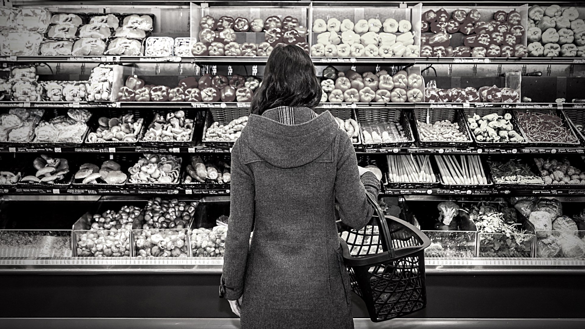 Woman looking at produce section