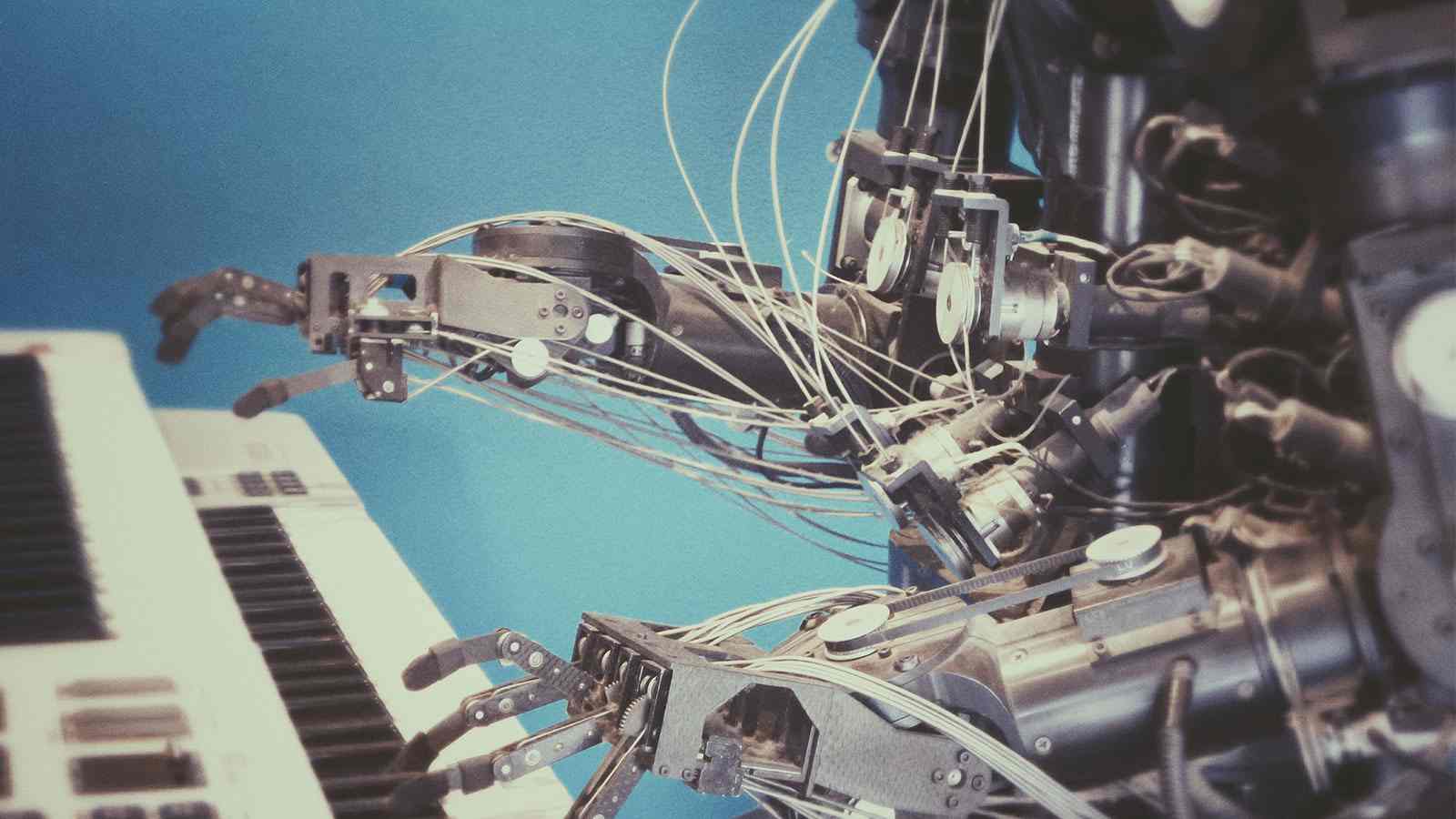 close up of robot playing piano