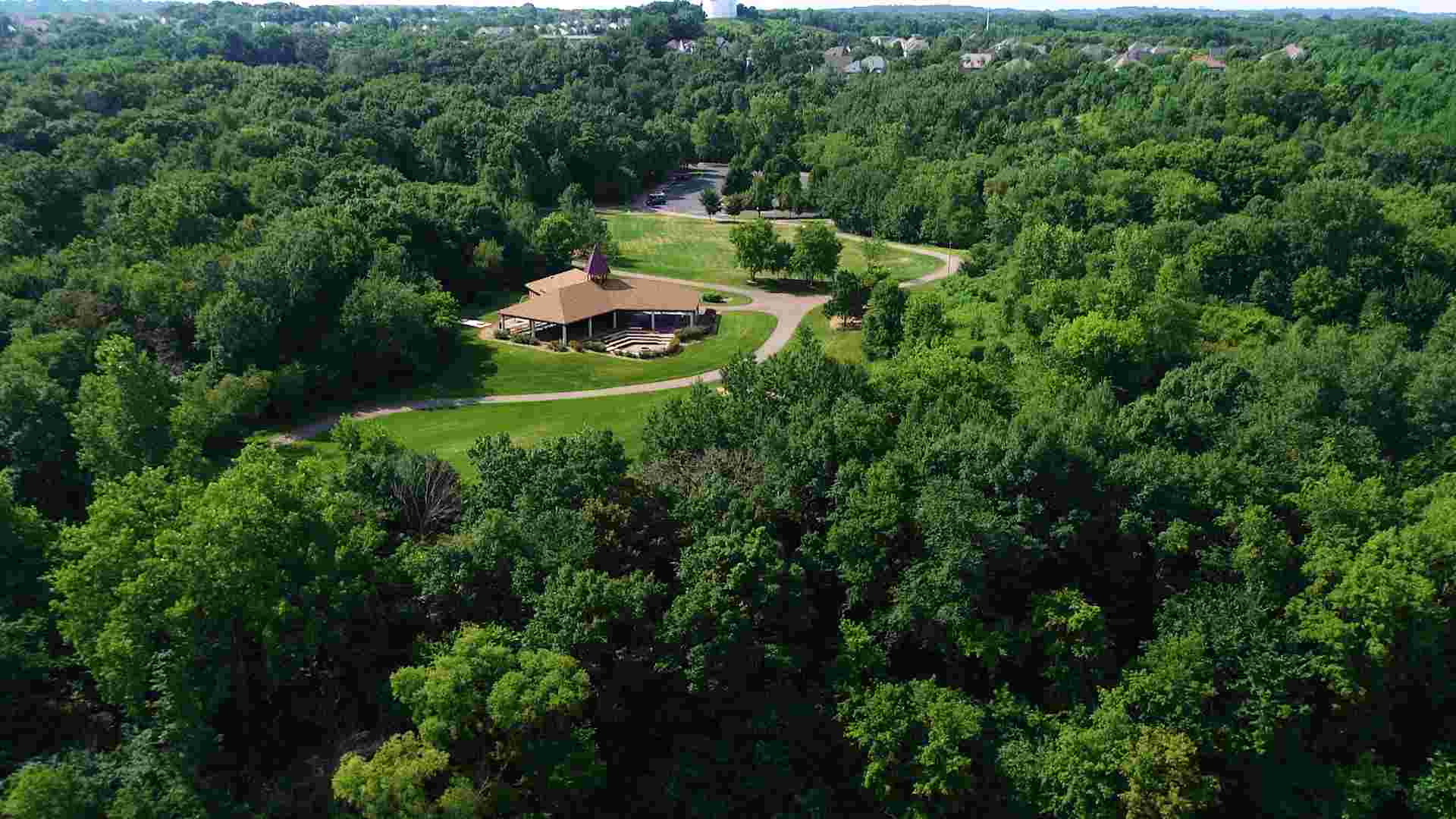 drone shot of Eagan park with dense tree canopy